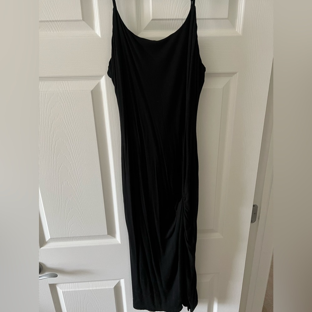 Black dress with a scrunched slit on the side